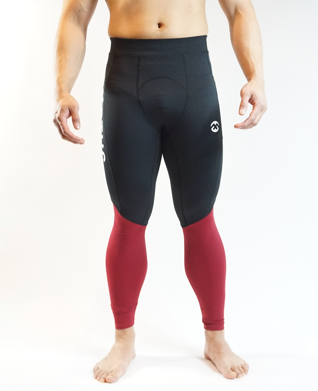 Men's training compression pants in black and red.